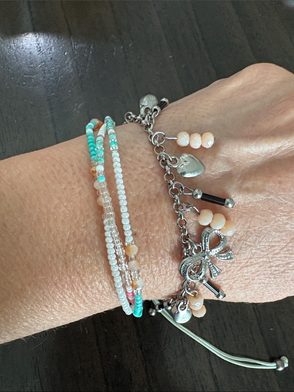 Silver Charm Bow Bracelet with Peach Beads and Turquoise Accent